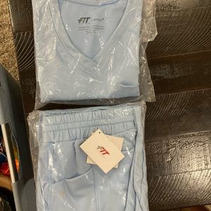 Light blue Fit Scrubs still in package! Size small